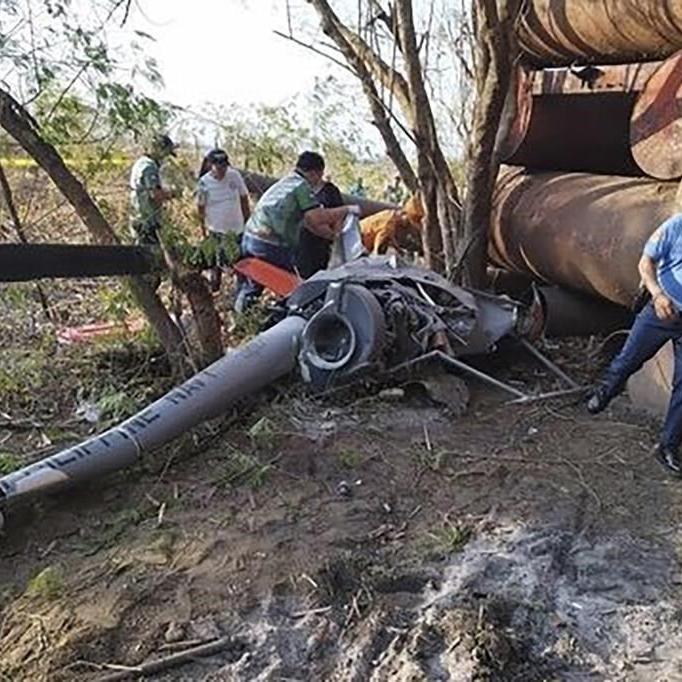 2 Philippine navy pilots killed after a training helicopter crashes near a public market and homes